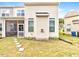 Back exterior of a home with a small back porch and a grassy backyard at 5410 Jessip Street St, Morrisville, NC 27560