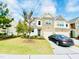 Inviting two-story home with a stone facade, attached garage, and well-manicured lawn at 5410 Jessip Street St, Morrisville, NC 27560