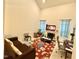 Cozy living room with fireplace, neutral carpet, high ceilings, and stylish decor at 5410 Jessip Street St, Morrisville, NC 27560