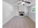 Spacious basement featuring a fireplace, carpeted floor, and a window at 5600 Brandycrest Dr, Raleigh, NC 27610