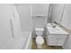 Clean bathroom with white fixtures including a vanity, toilet, and tub/shower combination at 5600 Brandycrest Dr, Raleigh, NC 27610
