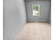 Neutral bedroom with carpet, a window offering natural light, and painted walls at 5600 Brandycrest Dr, Raleigh, NC 27610