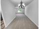 Spacious Dining room with neutral carpet and chandelier at 5600 Brandycrest Dr, Raleigh, NC 27610