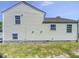 The exterior of the home features vinyl siding, multiple windows, and a foundation at 5600 Brandycrest Dr, Raleigh, NC 27610