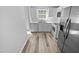 Well-equipped kitchen with white cabinets, stainless appliances, and wood-look flooring at 5600 Brandycrest Dr, Raleigh, NC 27610