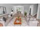 Stylishly staged living room with an open floor plan into dining area, perfect for modern living at 5600 Brandycrest Dr, Raleigh, NC 27610