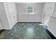 Bright, open room with updated flooring, white trim, and natural light from a window at 5600 Brandycrest Dr, Raleigh, NC 27610