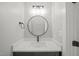 Bathroom featuring a modern sink with black hardware, mirror, and modern lighting at 621 Bon Air Ave, Durham, NC 27704