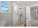 Bathroom with clear glass shower enclosure, white subway tile, and stone shower base at 621 Bon Air Ave, Durham, NC 27704