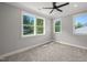 Bedroom with neutral walls, plush carpeting, large windows, ceiling fan and recessed lighting at 621 Bon Air Ave, Durham, NC 27704
