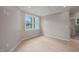 A naturally lit room with hardwood floors, fresh paint, and molding, perfect for relaxation and comfort at 621 Bon Air Ave, Durham, NC 27704