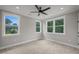 This naturally lit room provides an outdoor view, has carpeting, recessed lighting, and molding, a perfect canvas for your decor at 621 Bon Air Ave, Durham, NC 27704