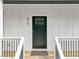 Inviting front door with modern hardware, set in a white frame and complemented by a 'Welcome' mat at 621 Bon Air Ave, Durham, NC 27704