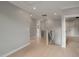 A naturally lit hallway with hardwood floors, fresh paint, and molding, perfect for a welcoming transition at 621 Bon Air Ave, Durham, NC 27704