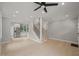 Spacious room that features hardwood floors, recessed lighting, and staircase with black metal spindles at 621 Bon Air Ave, Durham, NC 27704