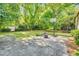 Spacious backyard with patio, storage shed and basketball court, ideal for entertaining and outdoor activities at 704 N Orange Ave, Dunn, NC 28334