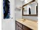 Well-lit bathroom with wooden vanity at 704 N Orange Ave, Dunn, NC 28334