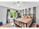Charming bedroom with a window view, featuring a cozy bed and fun decor for a playful atmosphere at 704 N Orange Ave, Dunn, NC 28334