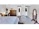 Cozy bedroom with carpet, featuring a dresser and mirror at 704 N Orange Ave, Dunn, NC 28334