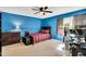 Cozy bedroom with a large window and a well-coordinated bed set, offering a comfortable retreat at 704 N Orange Ave, Dunn, NC 28334