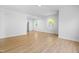 Open floor plan with hardwood flooring and view into the kitchen at 705 Hartford Rd, Raleigh, NC 27610