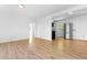 Open floor plan with hardwood flooring and view into the kitchen at 705 Hartford Rd, Raleigh, NC 27610