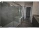Modern bathroom features a glass shower with gray tiling and a granite vanity countertop at 802 Brier Crossing Loop, Durham, NC 27703