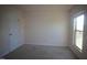 Bright bedroom with neutral carpet, a window, and a closet door providing ample space at 802 Brier Crossing Loop, Durham, NC 27703