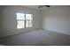 Bedroom with plush carpet and a bright window at 802 Brier Crossing Loop, Durham, NC 27703