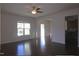 Open concept living room with hardwood floors and lots of natural light at 802 Brier Crossing Loop, Durham, NC 27703