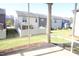 The screened patio overlooks a grassy backyard and neighboring houses, perfect for relaxation at 802 Brier Crossing Loop, Durham, NC 27703