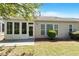 This home's backyard includes a patio for outdoor seating and a beautiful, enclosed sunroom at 803 Footbridge Pl, Cary, NC 27519