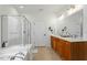 Bright bathroom with double vanity, bathtub and glass enclosed shower at 803 Footbridge Pl, Cary, NC 27519