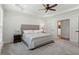 This bedroom boasts tray ceilings, ceiling fan and neutral colors at 803 Footbridge Pl, Cary, NC 27519