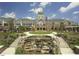 Grand clubhouse with manicured landscaping, a water feature, and an impressive entrance at 803 Footbridge Pl, Cary, NC 27519