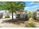 Beautiful home with well-maintained lawn, mature trees, and classic architectural details at 803 Footbridge Pl, Cary, NC 27519