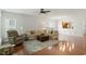 Spacious living room featuring an oversized sectional sofa, hardwood floors, and neutral decor at 803 Footbridge Pl, Cary, NC 27519