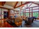 Relaxing lounge area with a vaulted ceiling, stone fireplace and lots of natural light at 803 Footbridge Pl, Cary, NC 27519