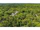 An aerial view of a home surrounded by lush greenery and trees at 803 Old Mill Rd, Chapel Hill, NC 27514