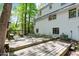 Exterior view of home, with an expansive wooden deck, benches, and yard at 803 Old Mill Rd, Chapel Hill, NC 27514