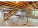 Unfinished basement with pool table, exposed ceiling and support beams at 803 Old Mill Rd, Chapel Hill, NC 27514