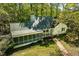Charming home featuring screened-in porch, with mature trees and well-maintained lawn at 803 Old Mill Rd, Chapel Hill, NC 27514