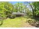 Charming home featuring screened-in porch, with mature trees and well-maintained lawn at 803 Old Mill Rd, Chapel Hill, NC 27514