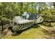 Charming home featuring screened-in porch, with mature trees and well-maintained lawn at 803 Old Mill Rd, Chapel Hill, NC 27514