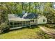 Charming single-story home featuring a screened porch, white exterior, and a brick pathway at 803 Old Mill Rd, Chapel Hill, NC 27514