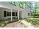 Home's inviting entrance with brick pathway, covered porch, and well-maintained landscaping at 803 Old Mill Rd, Chapel Hill, NC 27514