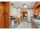 Cozy kitchen includes wood cabinets and stainless steel appliances, offering both style and function at 803 Old Mill Rd, Chapel Hill, NC 27514