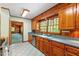 This kitchen has wood cabinets, stainless appliances and leads to a living room at 803 Old Mill Rd, Chapel Hill, NC 27514