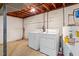 Functional laundry area with washer, dryer, and water heater at 803 Old Mill Rd, Chapel Hill, NC 27514