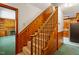 Stairway with carpet treads and wooden railing provides access to other parts of the home at 803 Old Mill Rd, Chapel Hill, NC 27514